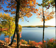A lake surrounded by trees in autumn.