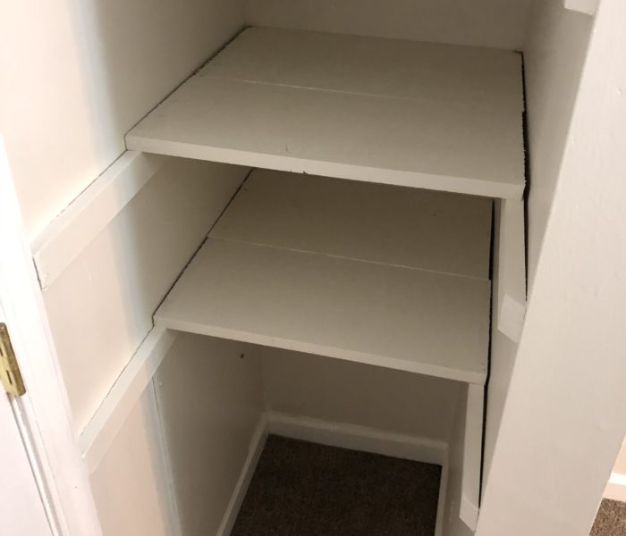 An Empty Shelves in White in a Closet Space
